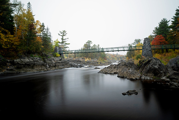 Swinging Bridge In Fall